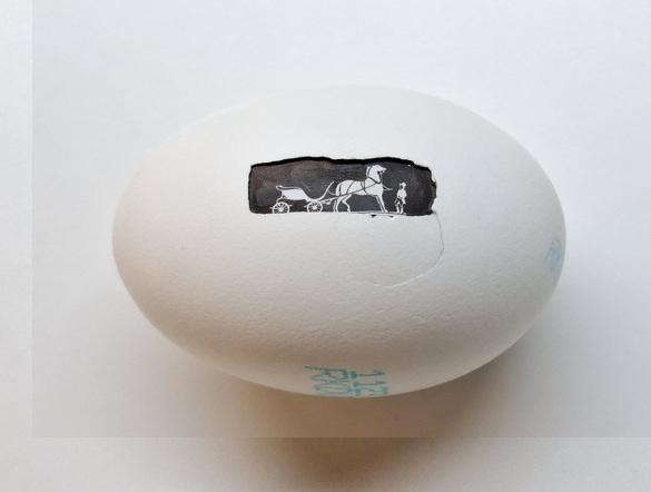 New Proteins (Strange but all Ours), Hermes, 2025, Eierschale, gefundene Verpackung, Mischtechnik